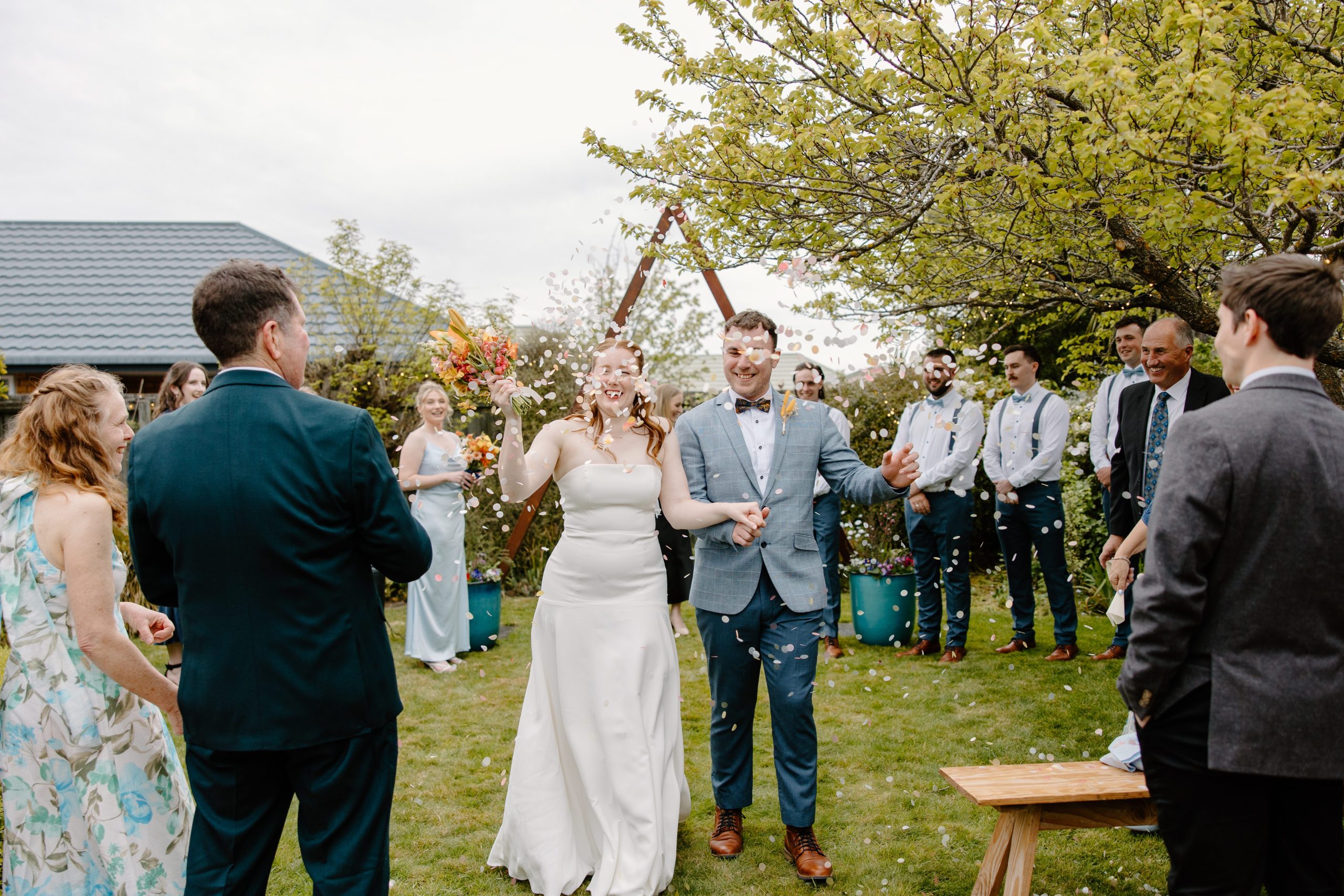 Christchurch Garden Wedding Bride and Groom with confetti