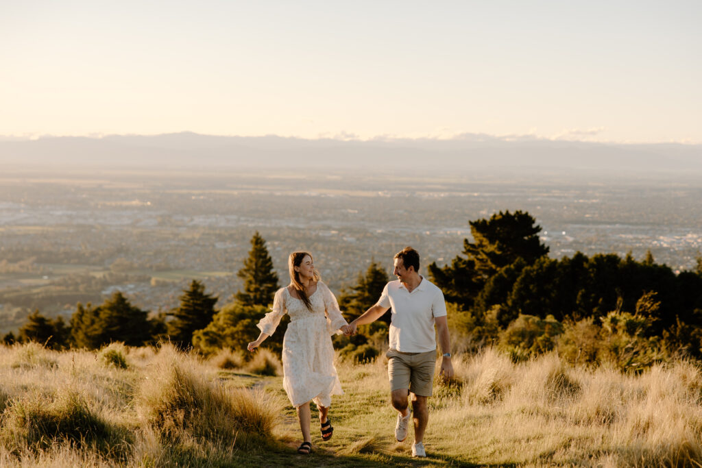 Chasing golden light in The Port Hills Couple in the grass
