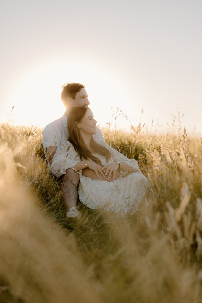 Chasing golden light in The Port Hills Couple in the grass