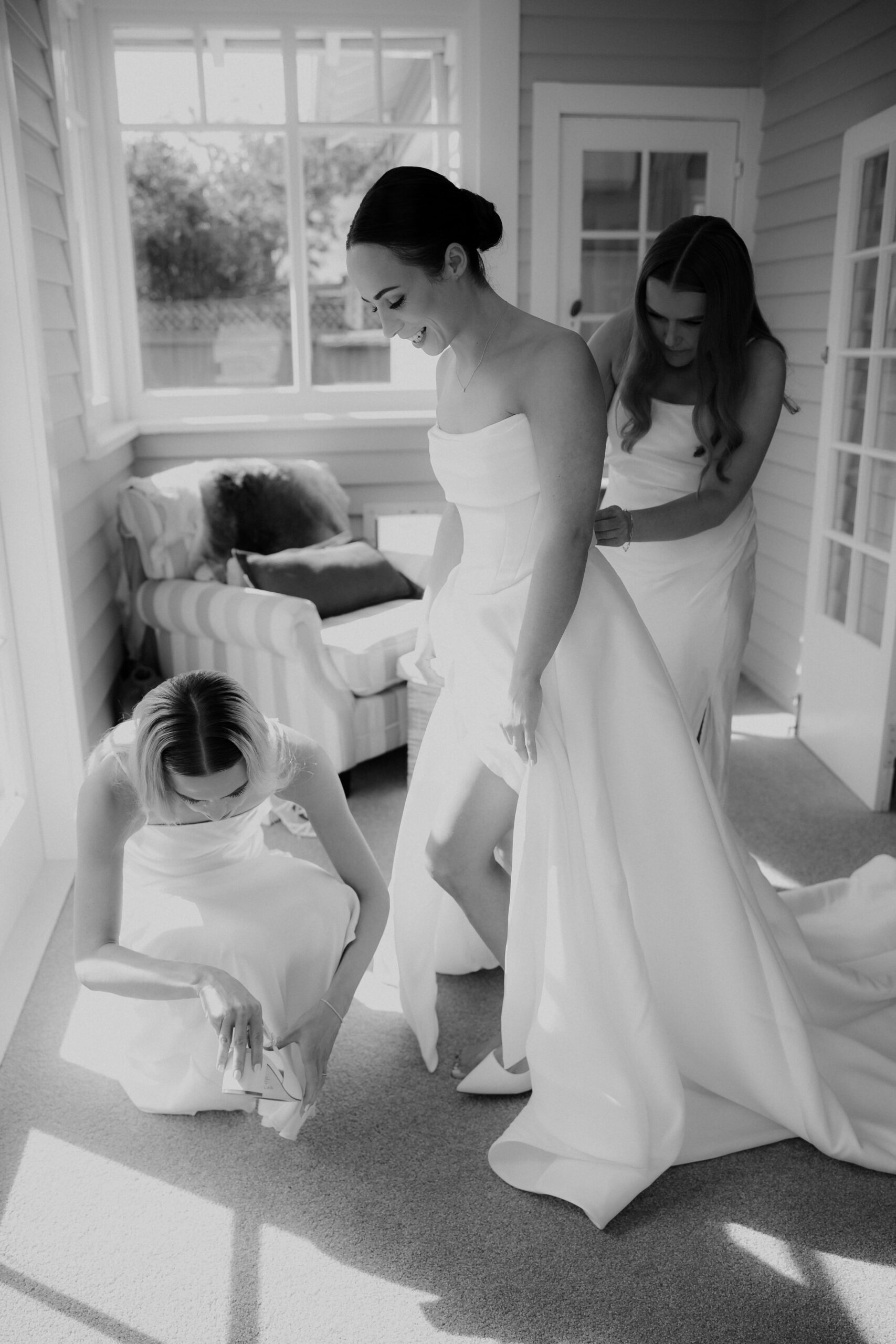 Black and white photo of the bride getting dressed before Mona Vale Wedding