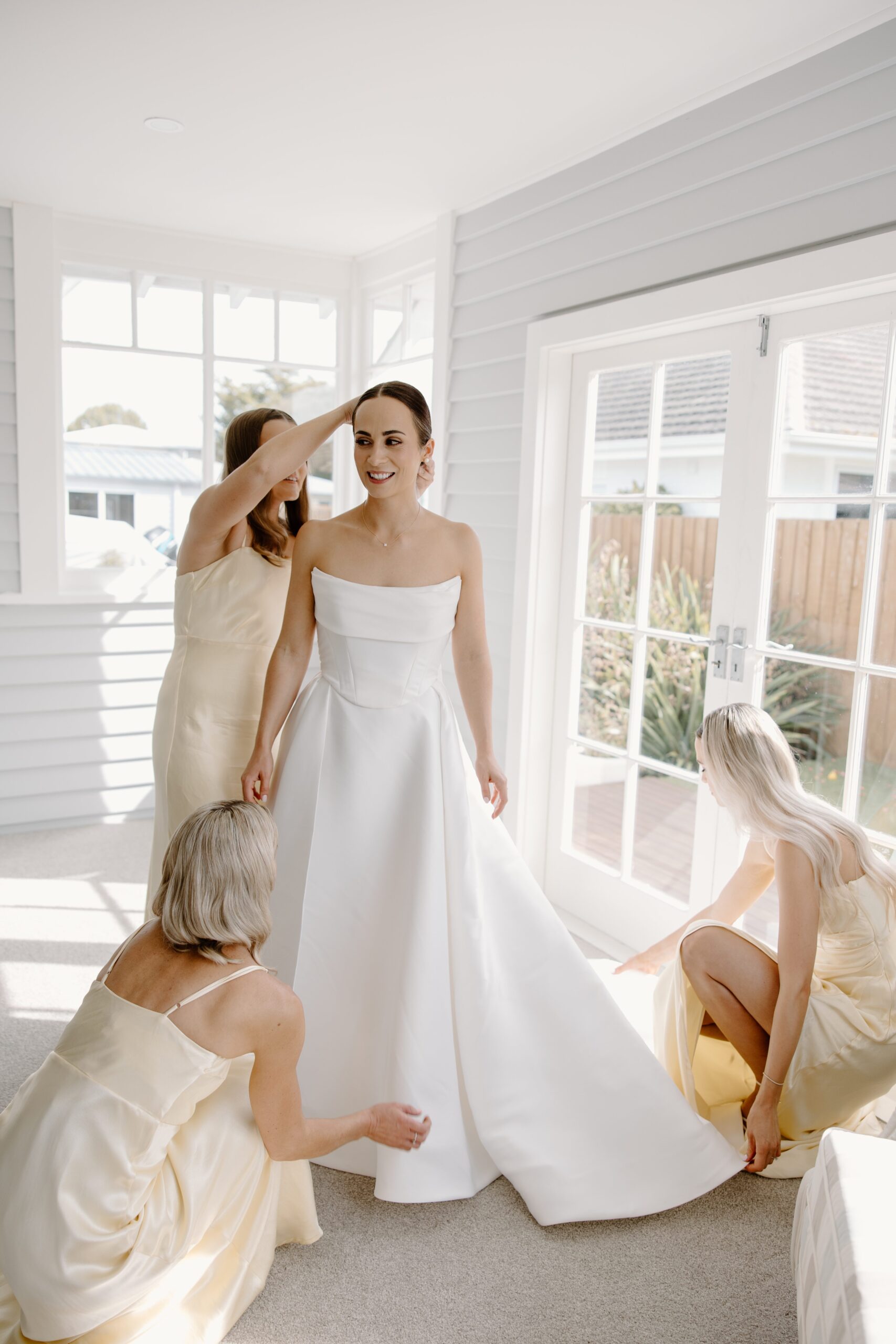 bride getting dressed before Mona Vale Wedding