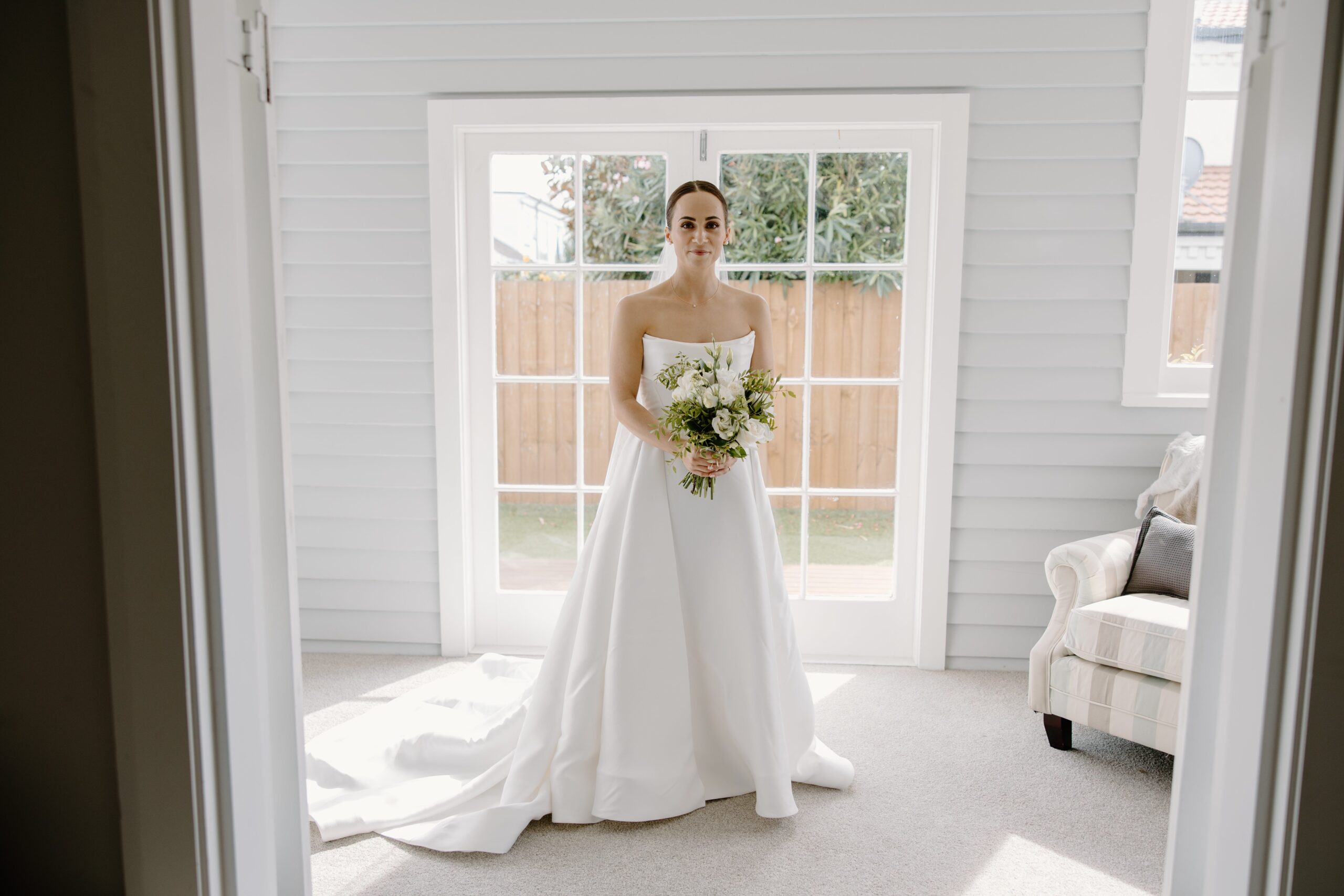 bride getting dressed before Mona Vale Wedding