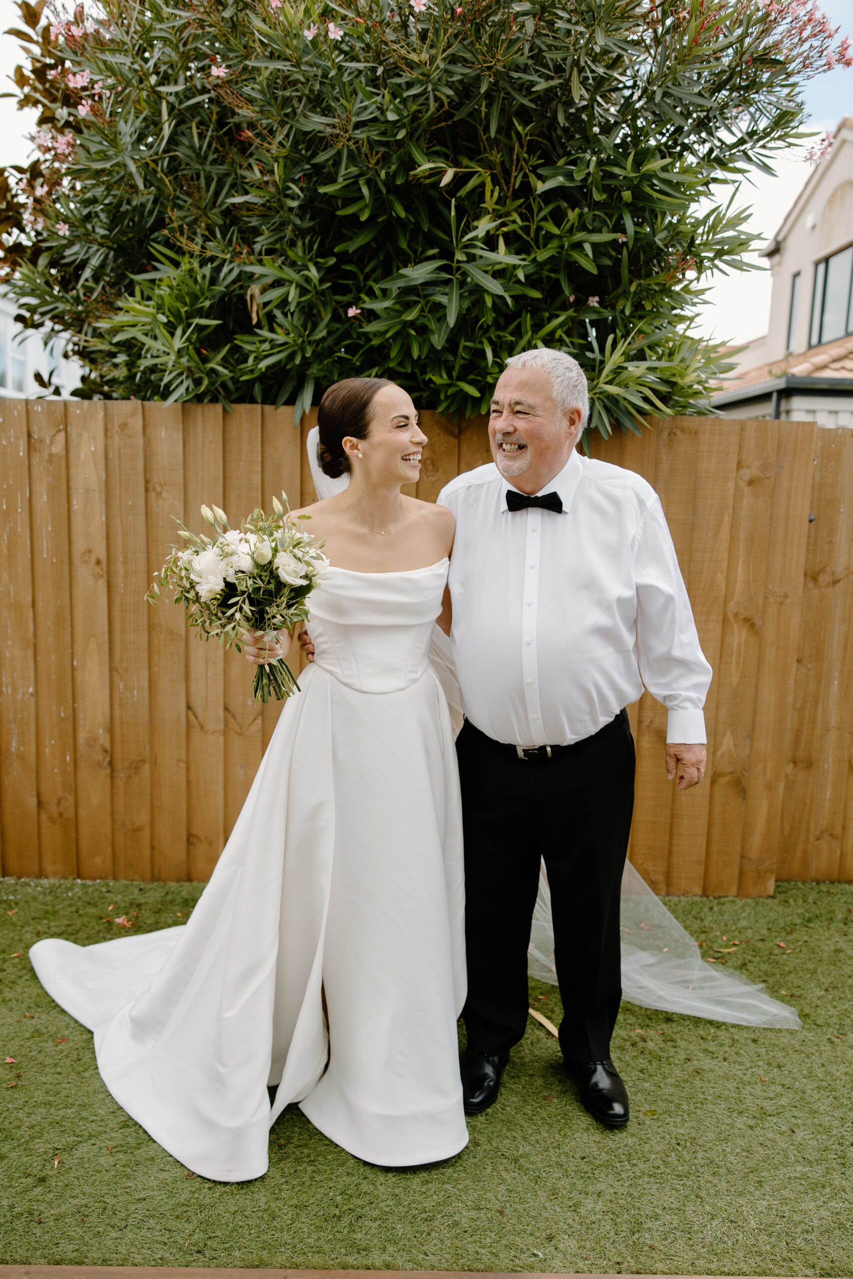 Bride and Father standing together outside