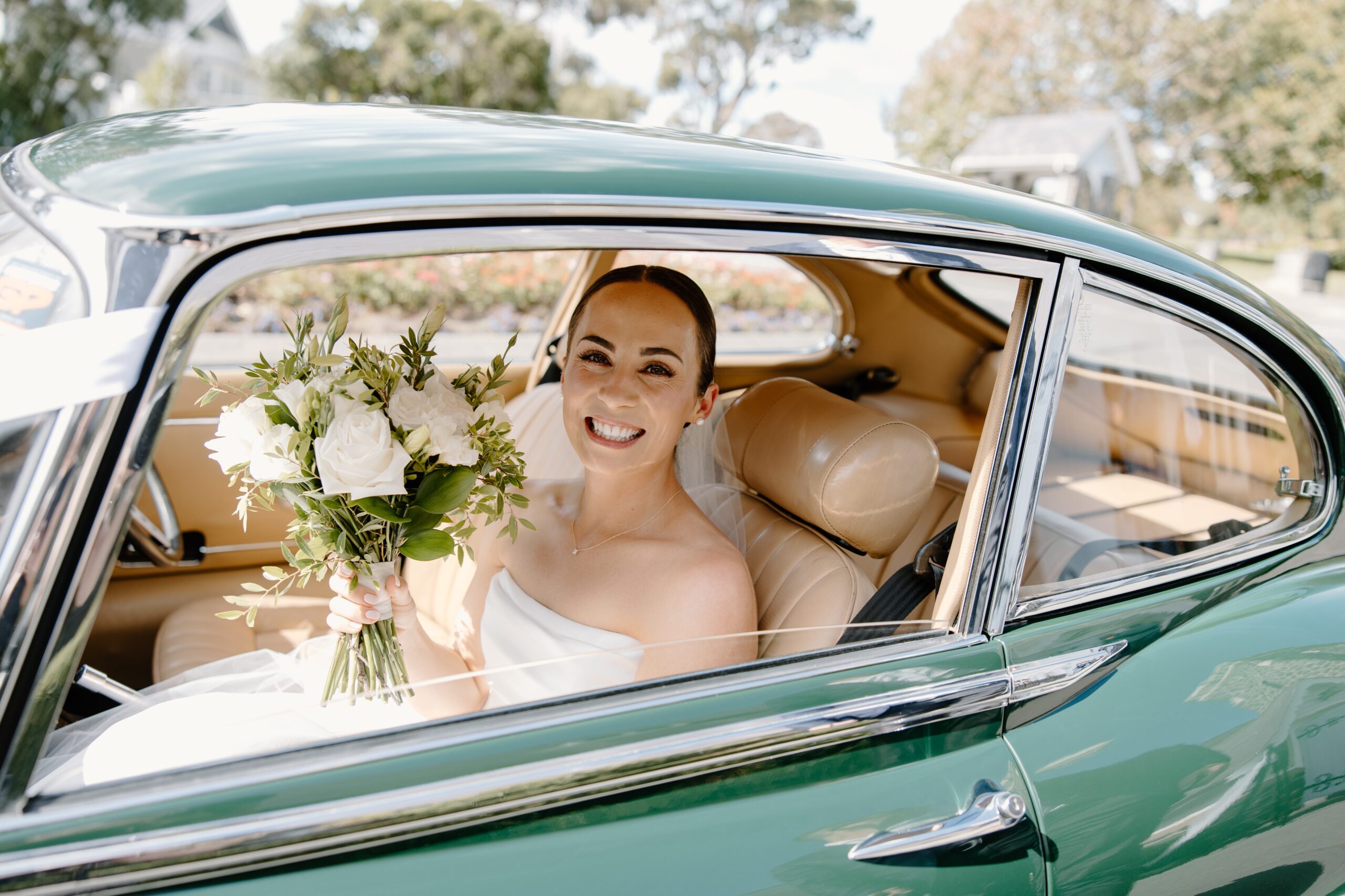 Bride arriving at the Church in a green car