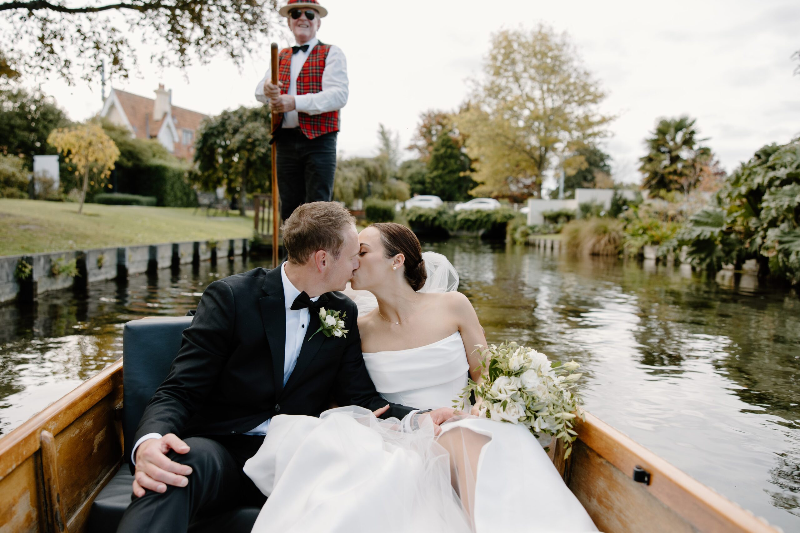 Coupe punting on the River Avon at their Mona Vale Wedding