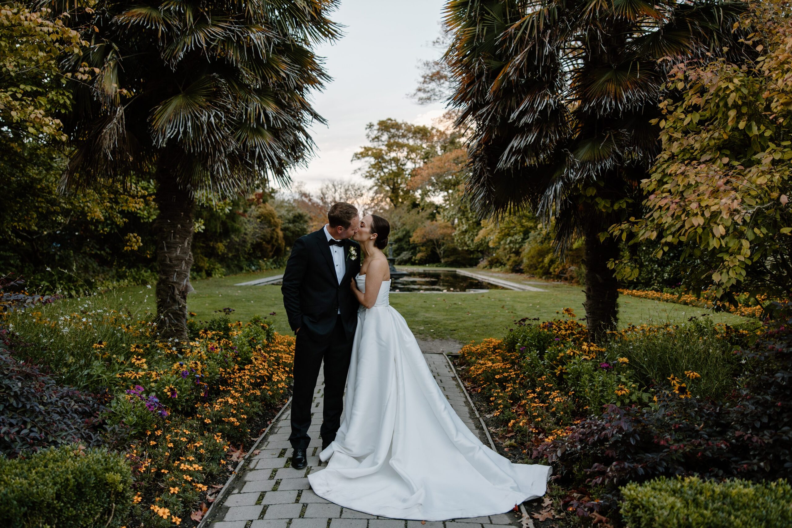 Bride and Groom kissing at Sunset in Mona Vale Gardens