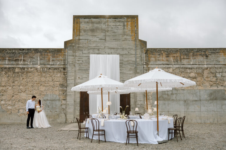 Couple outside The Flaxmill, Oxford set up for an Itallian inspired wedding